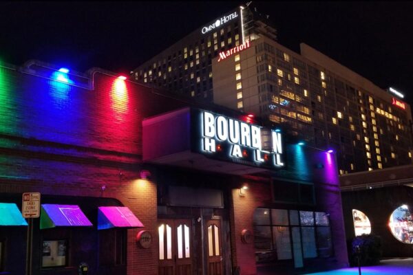 possible website picture for Bourbon Hall Conecert picture from the outside with the color lights